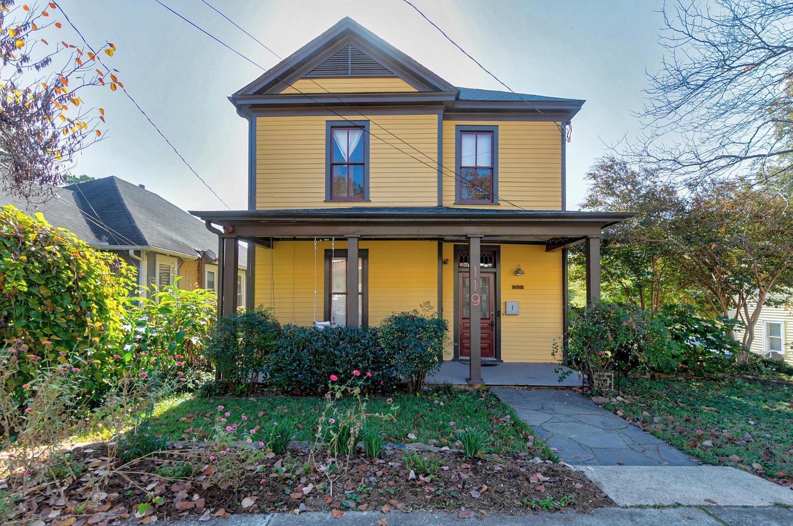 a front view of a house with garden