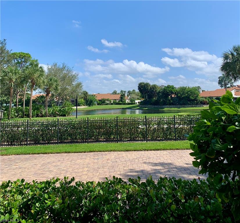 a view of a yard with a lake view