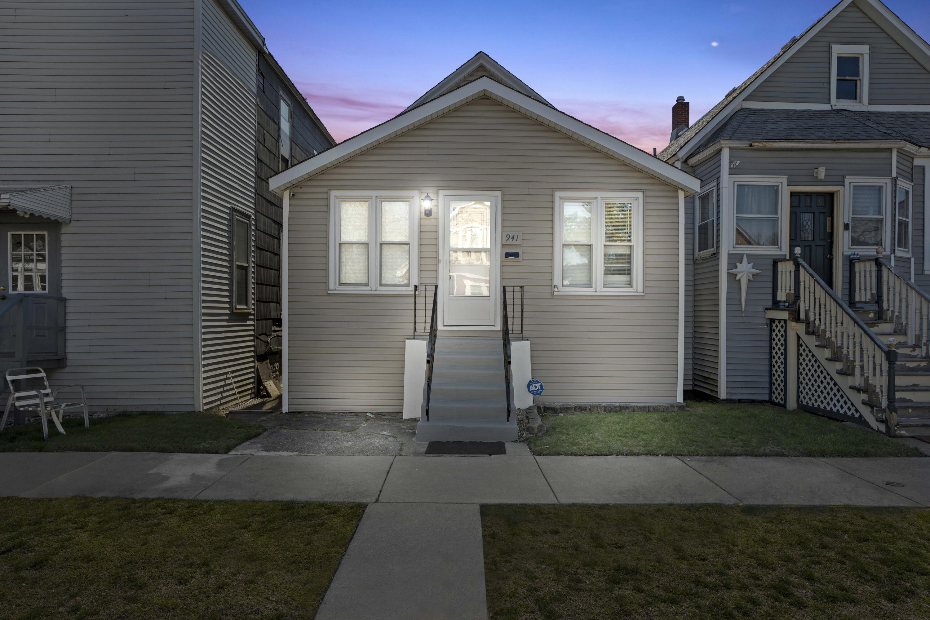 a front view of a house with yard