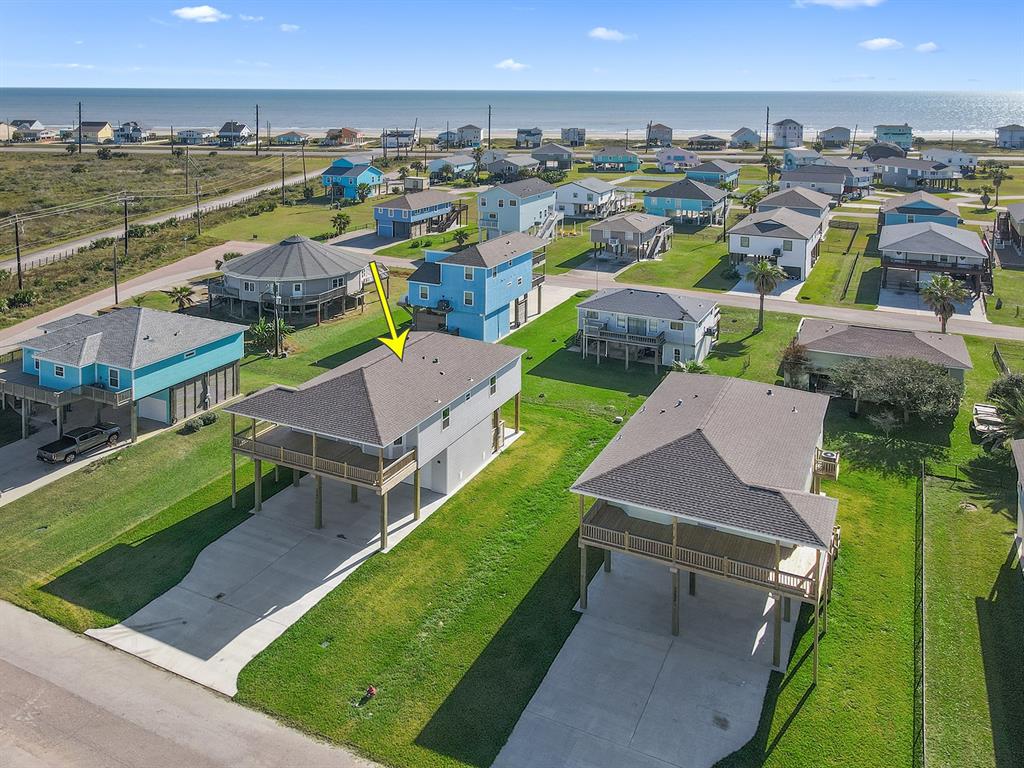 an aerial view of a house with a garden