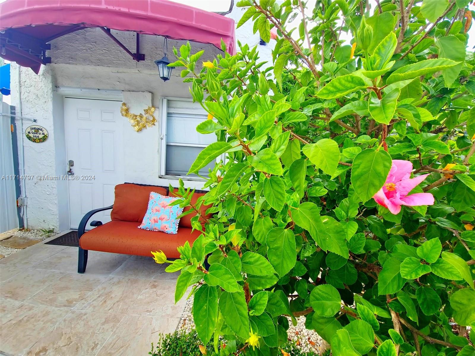 a backyard of a house with seating space