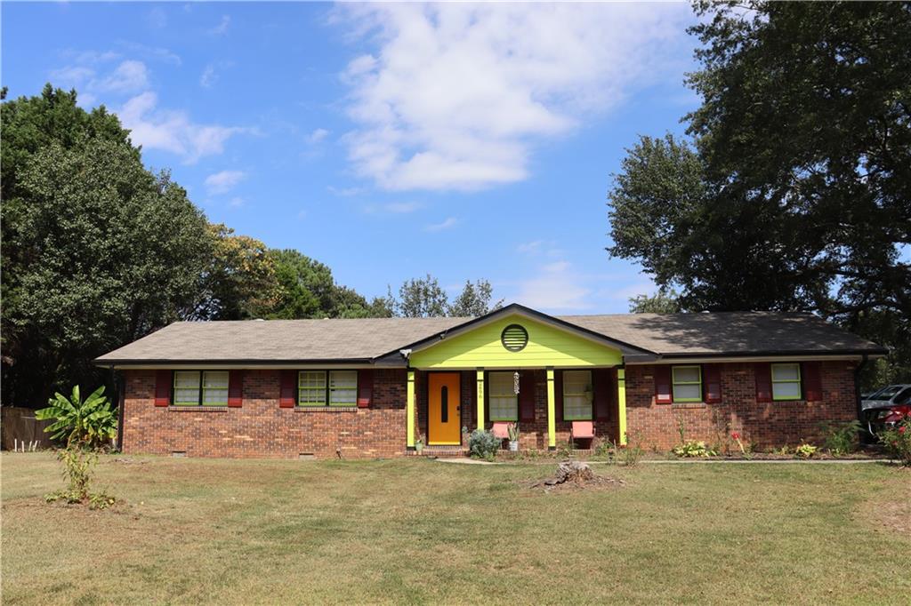 a front view of a house with garden