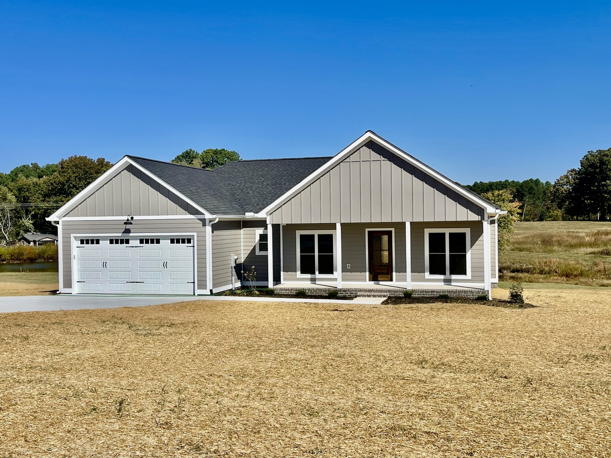 a front view of a house with a yard