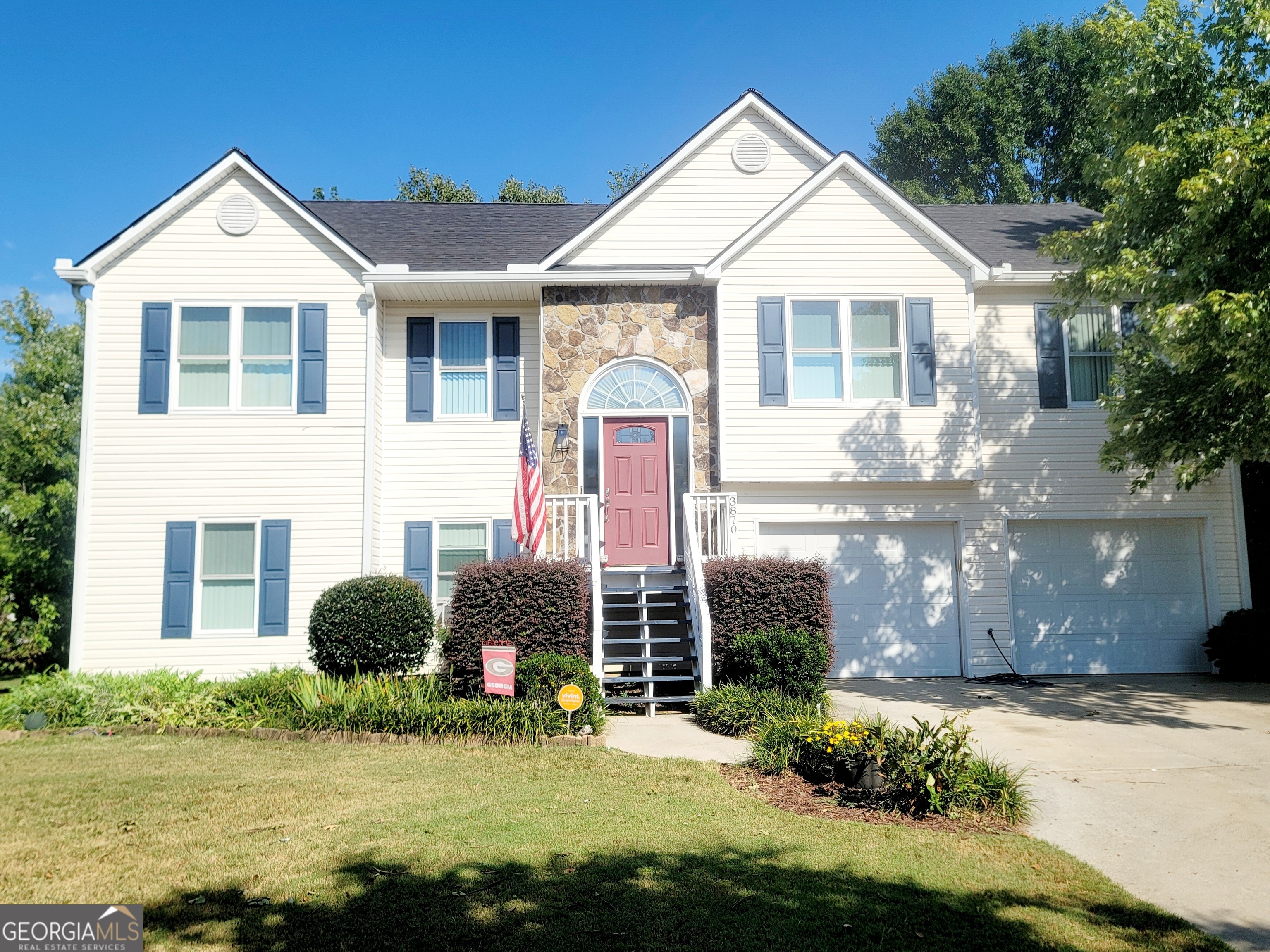 a front view of a house with a yard