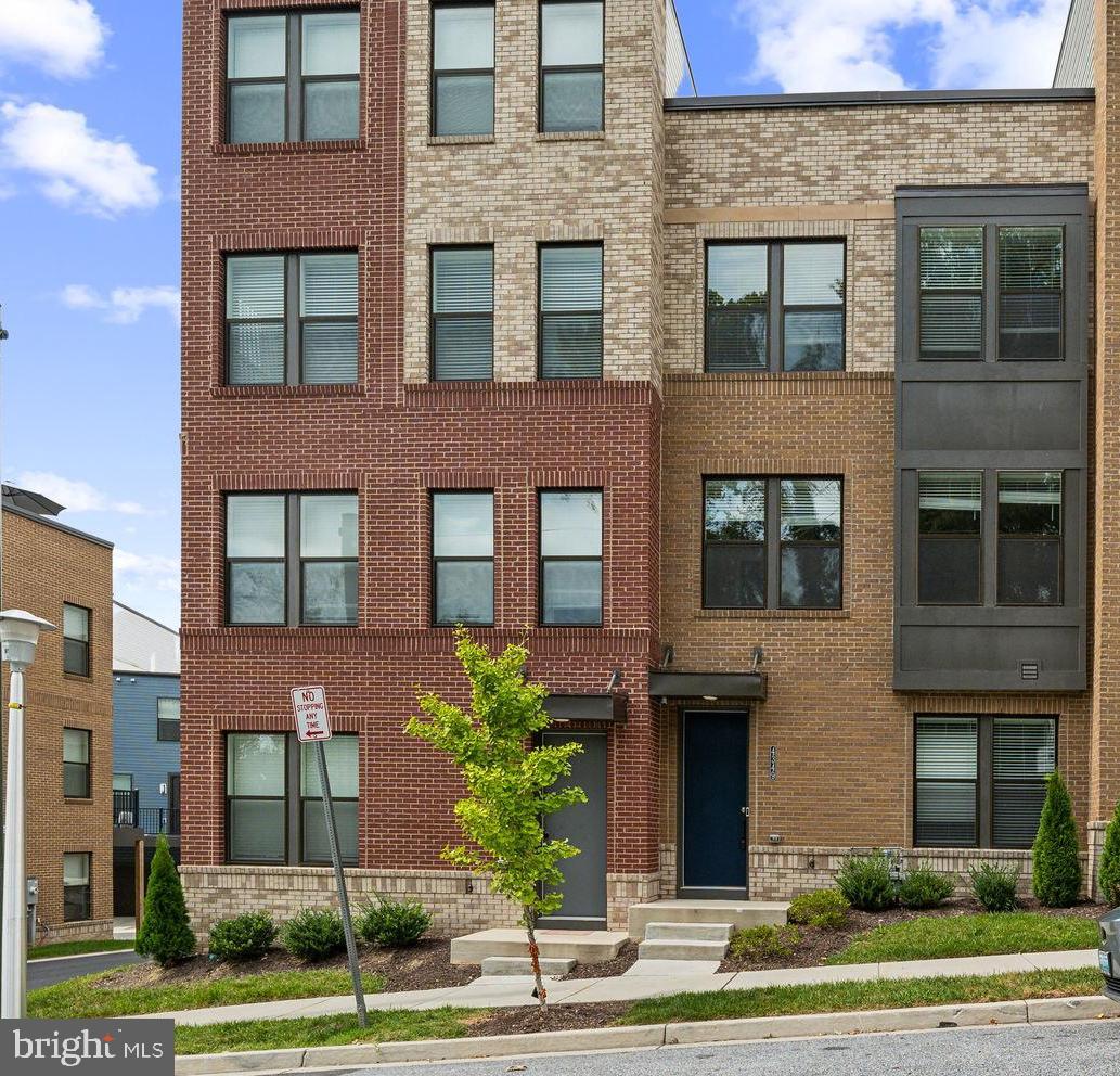 a front view of a multi story residential apartment building