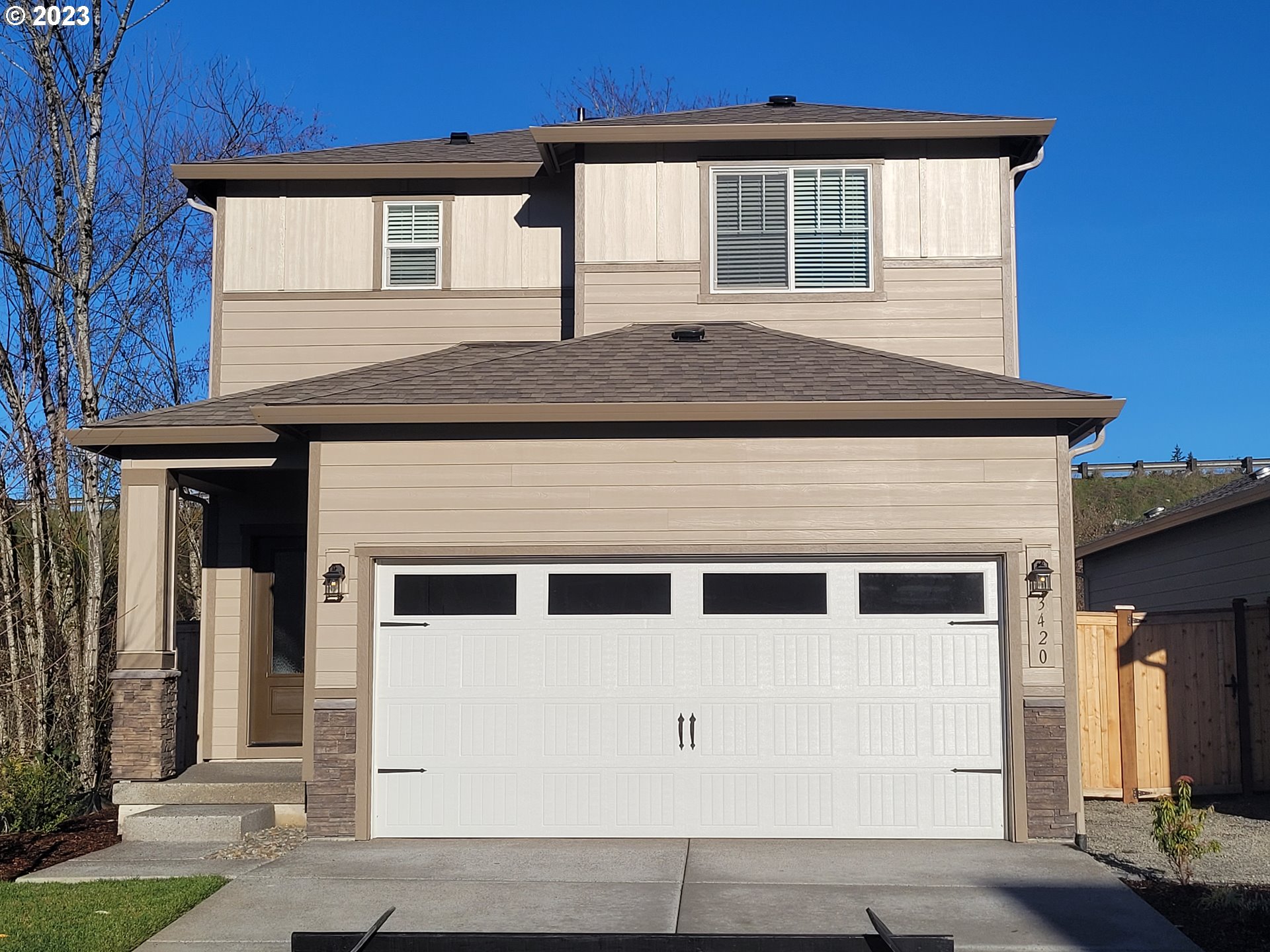 a front view of a house with a garage