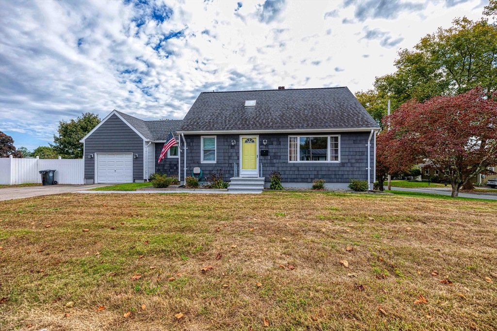 a front view of a house with a yard