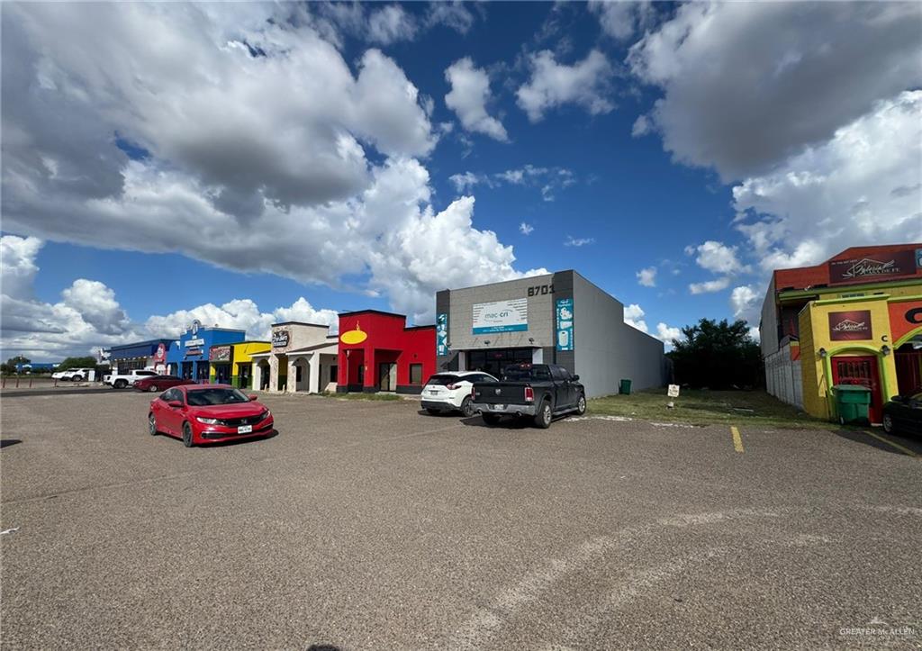 a view of a city street with cars