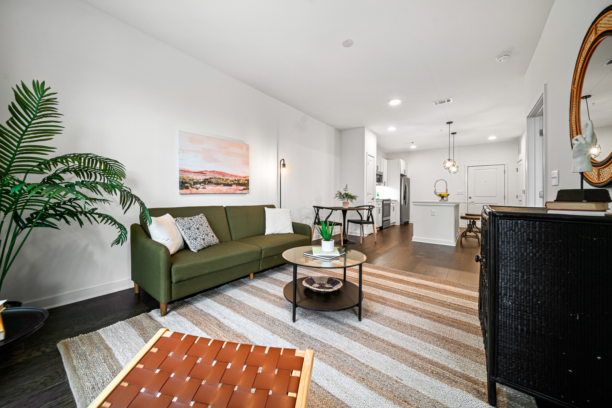 a living room with furniture and a rug