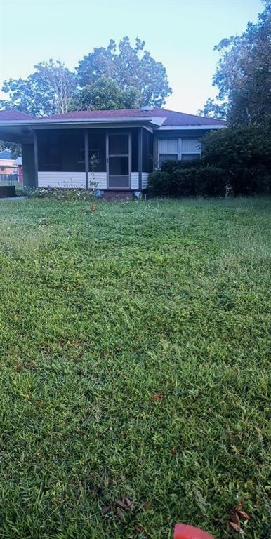 a backyard of a house with lots of green space