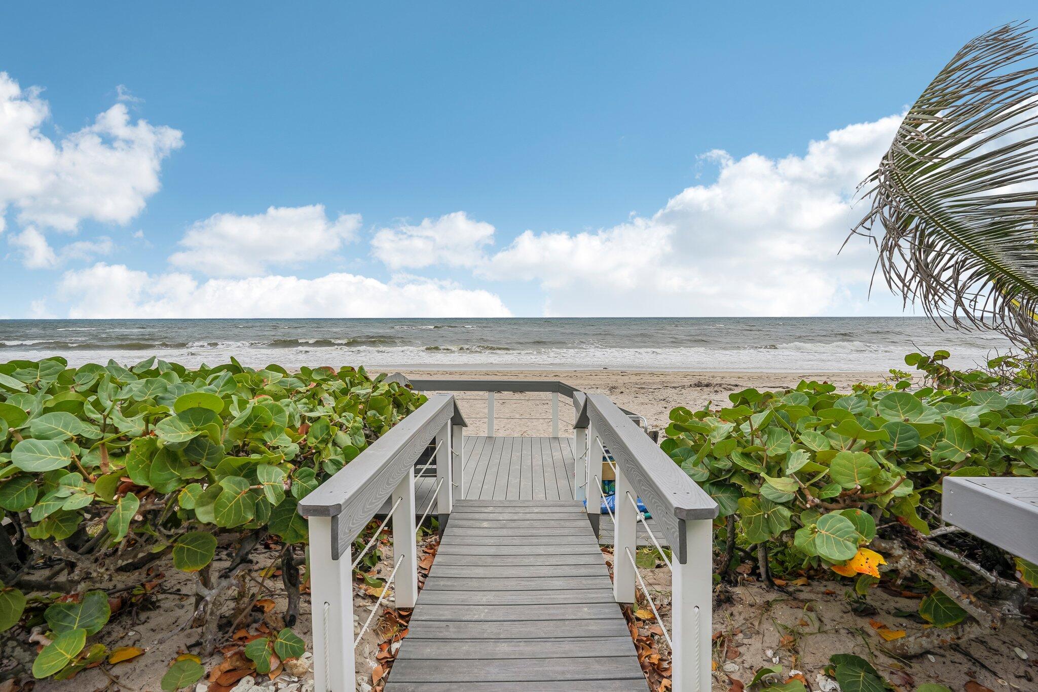 a view of a balcony with an ocean view