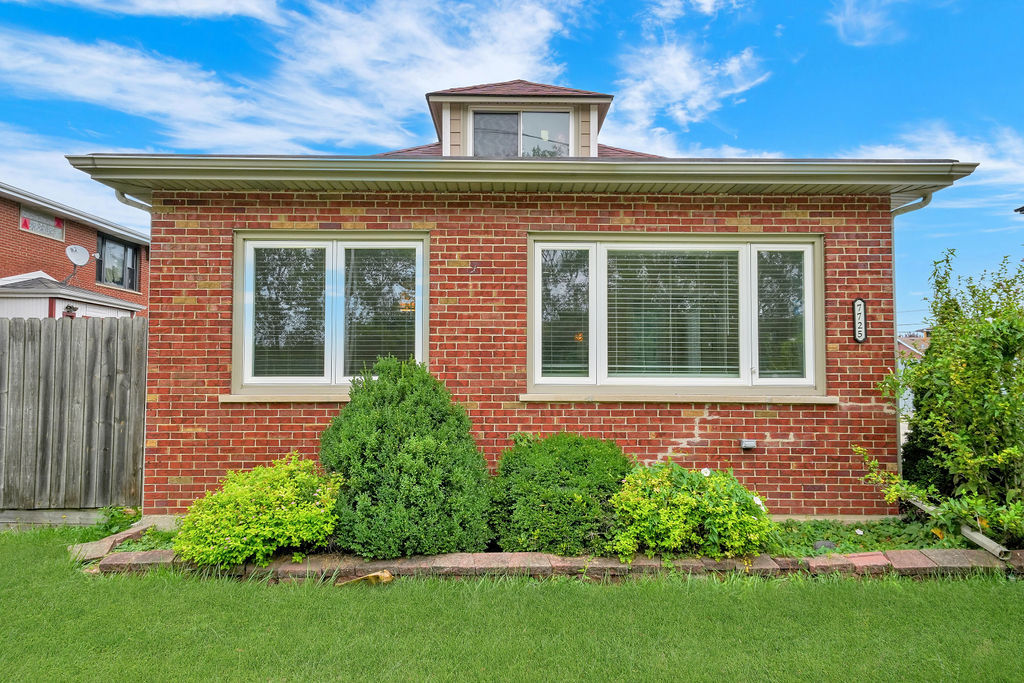 a view of a house with a large window