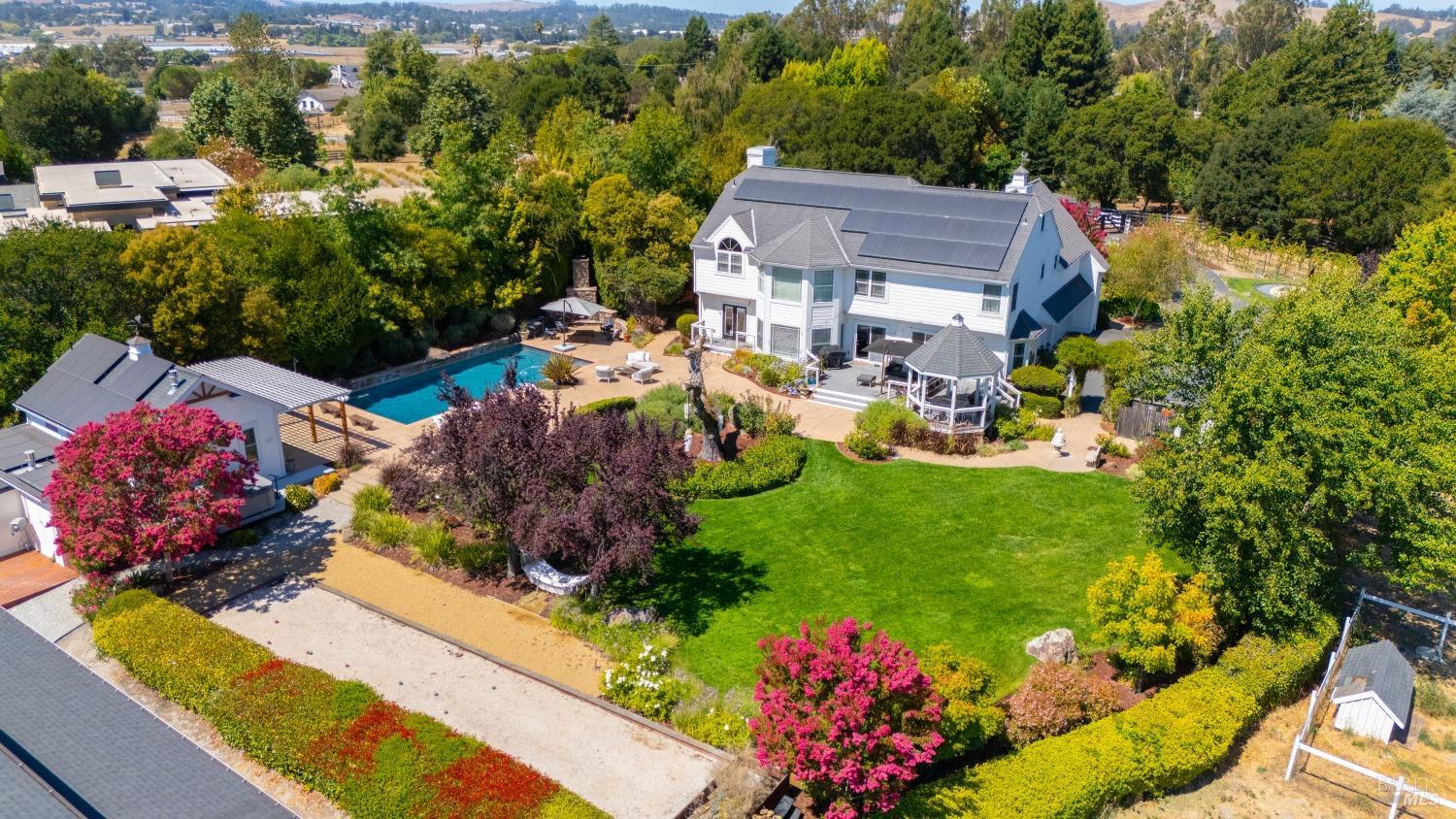 a view of a house with a flower garden