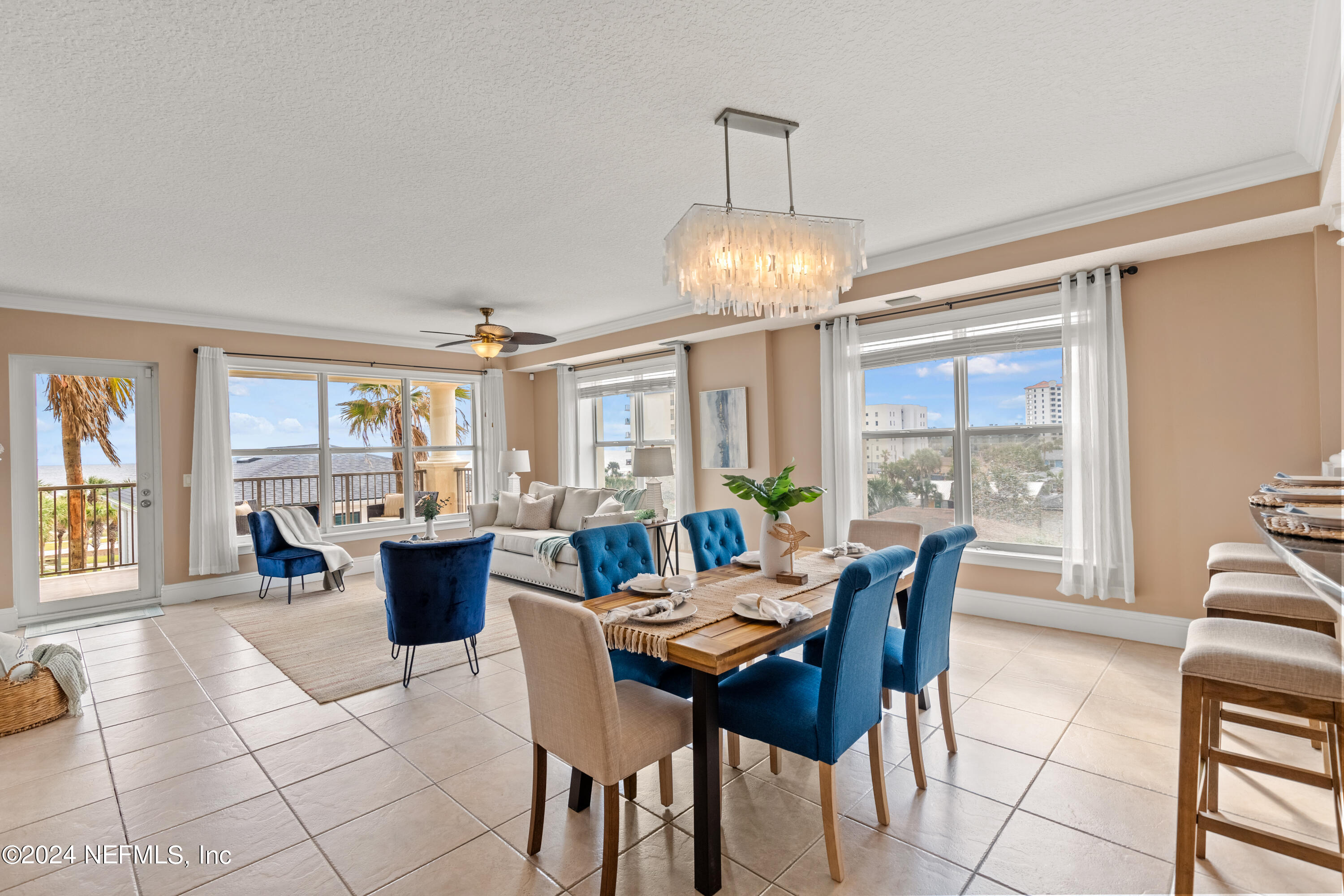 a view of a dining room with furniture wooden floor and chandelier