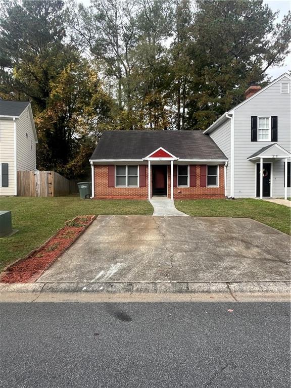 front view of a house with a yard