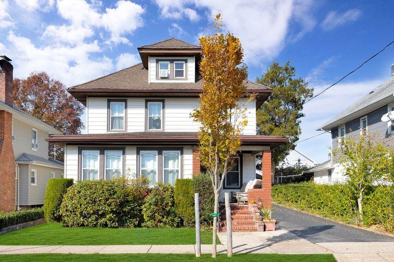 View of front of property with a front yard