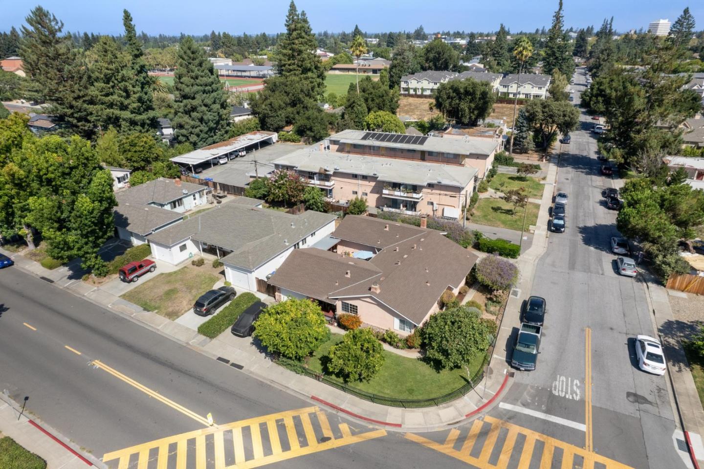 an aerial view of residential houses with outdoor space