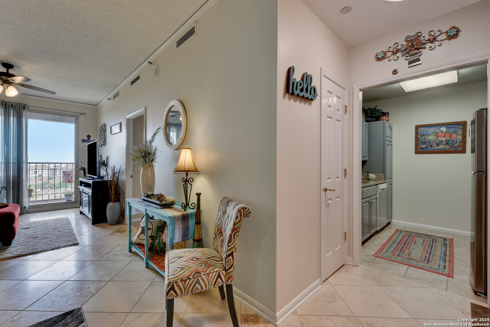 a bedroom with furniture and a mirror