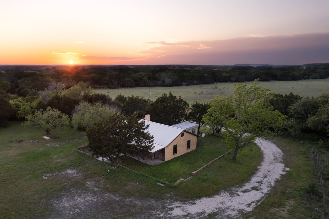 an aerial view of a house with mountain view