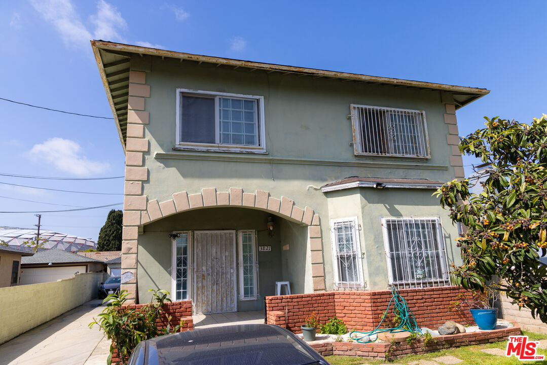 a front view of a house with garage