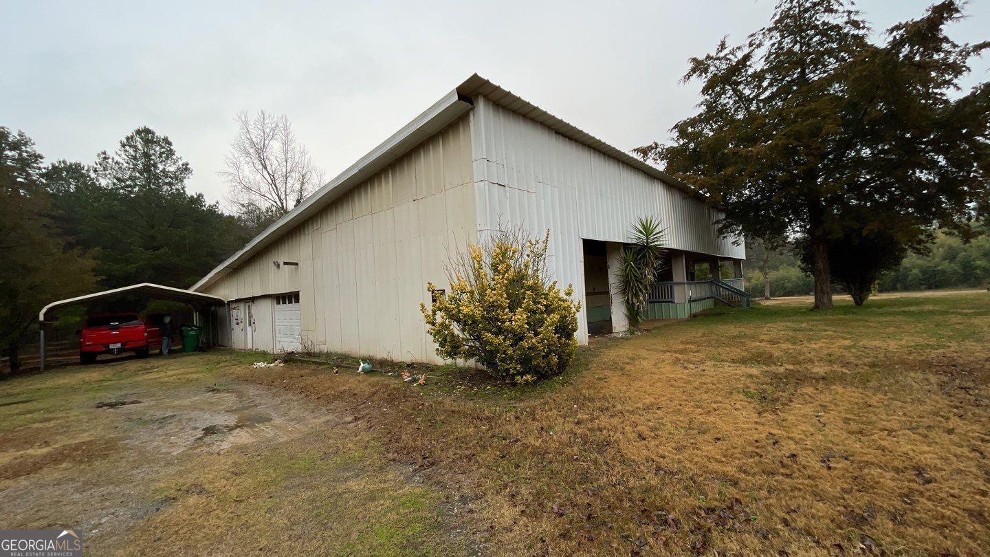 a view of a house with a yard and garage