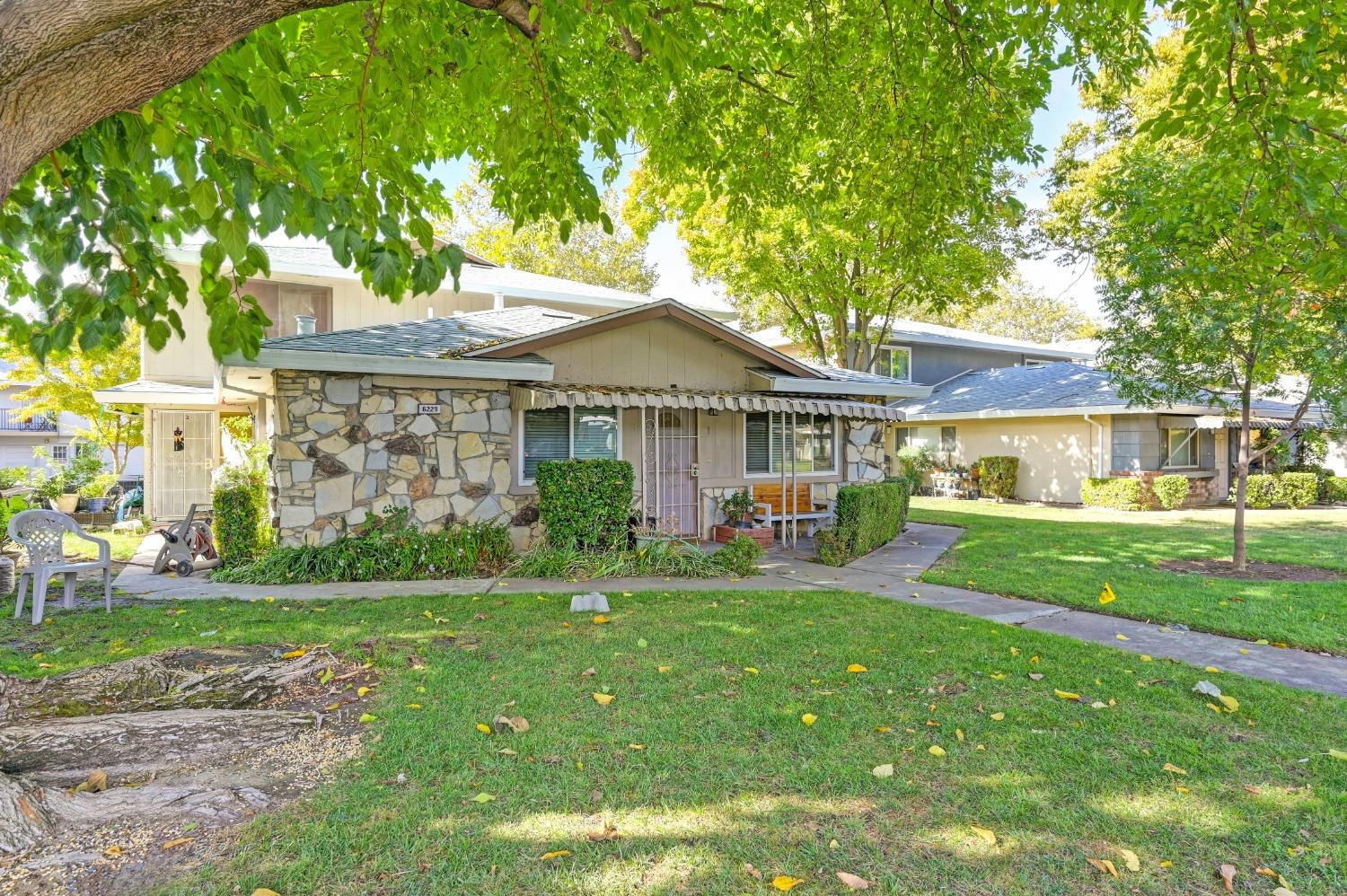 a front view of a house with garden