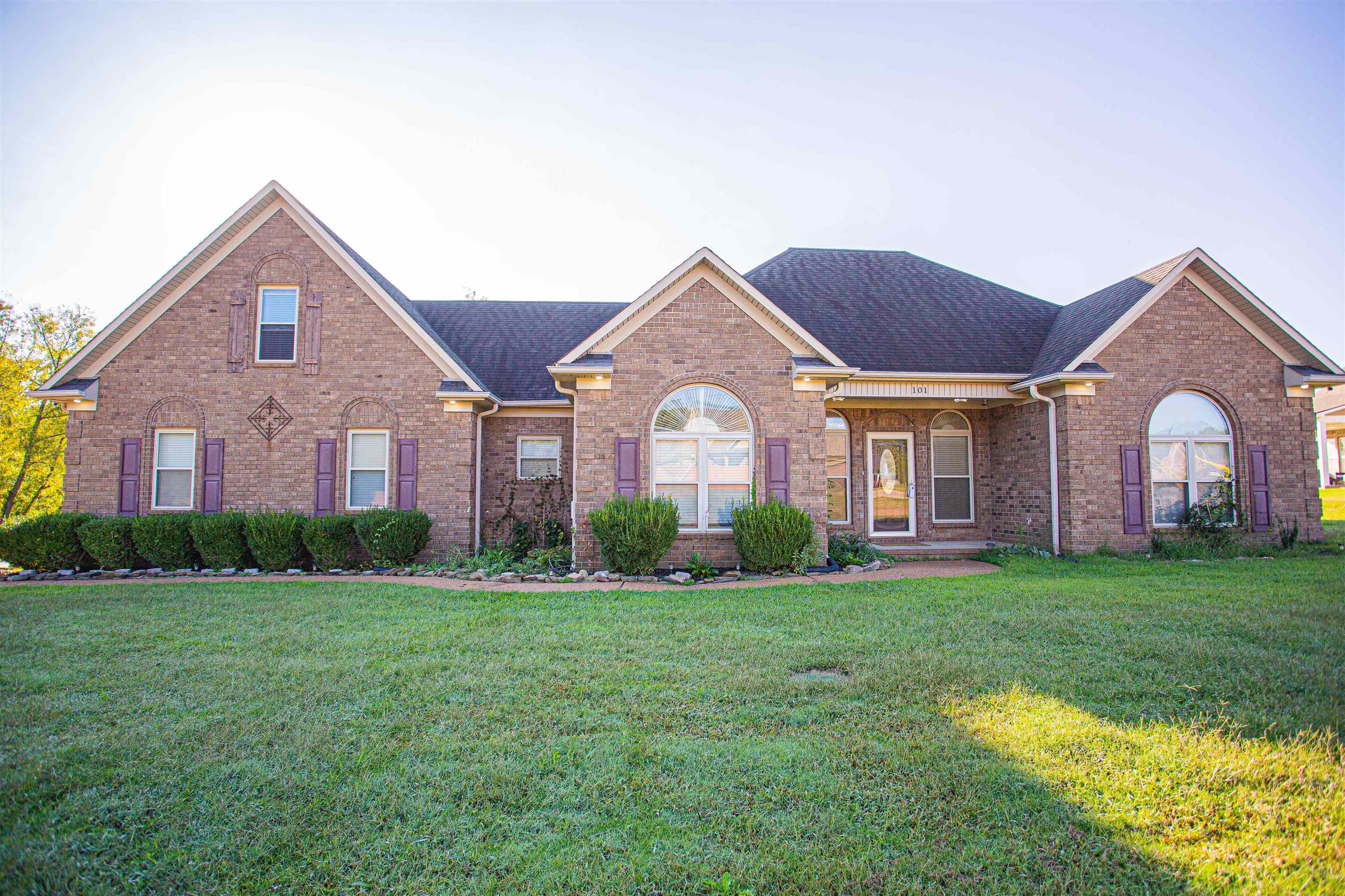 View of front of house with a front yard