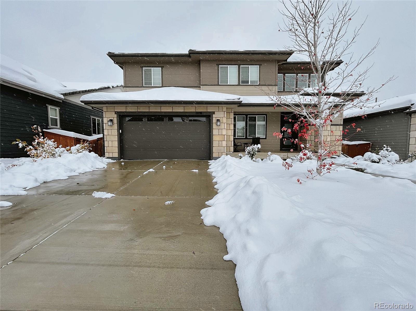 a front view of a house with garage