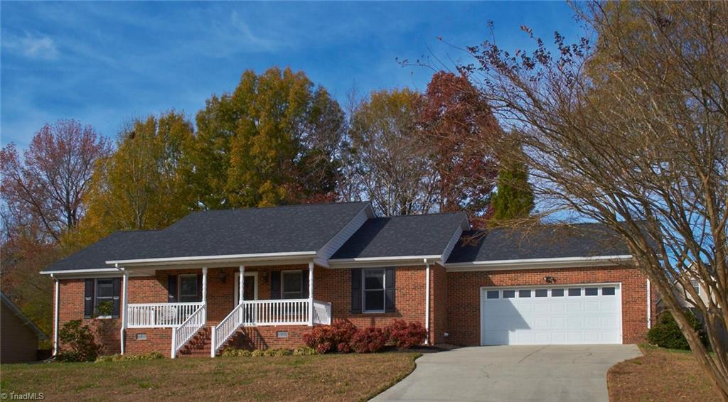 One level brick home with covered front porch and spacious 2 car garage!