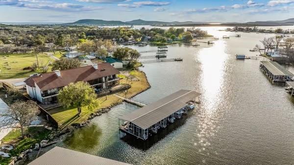 aerial view of a house with a lake view