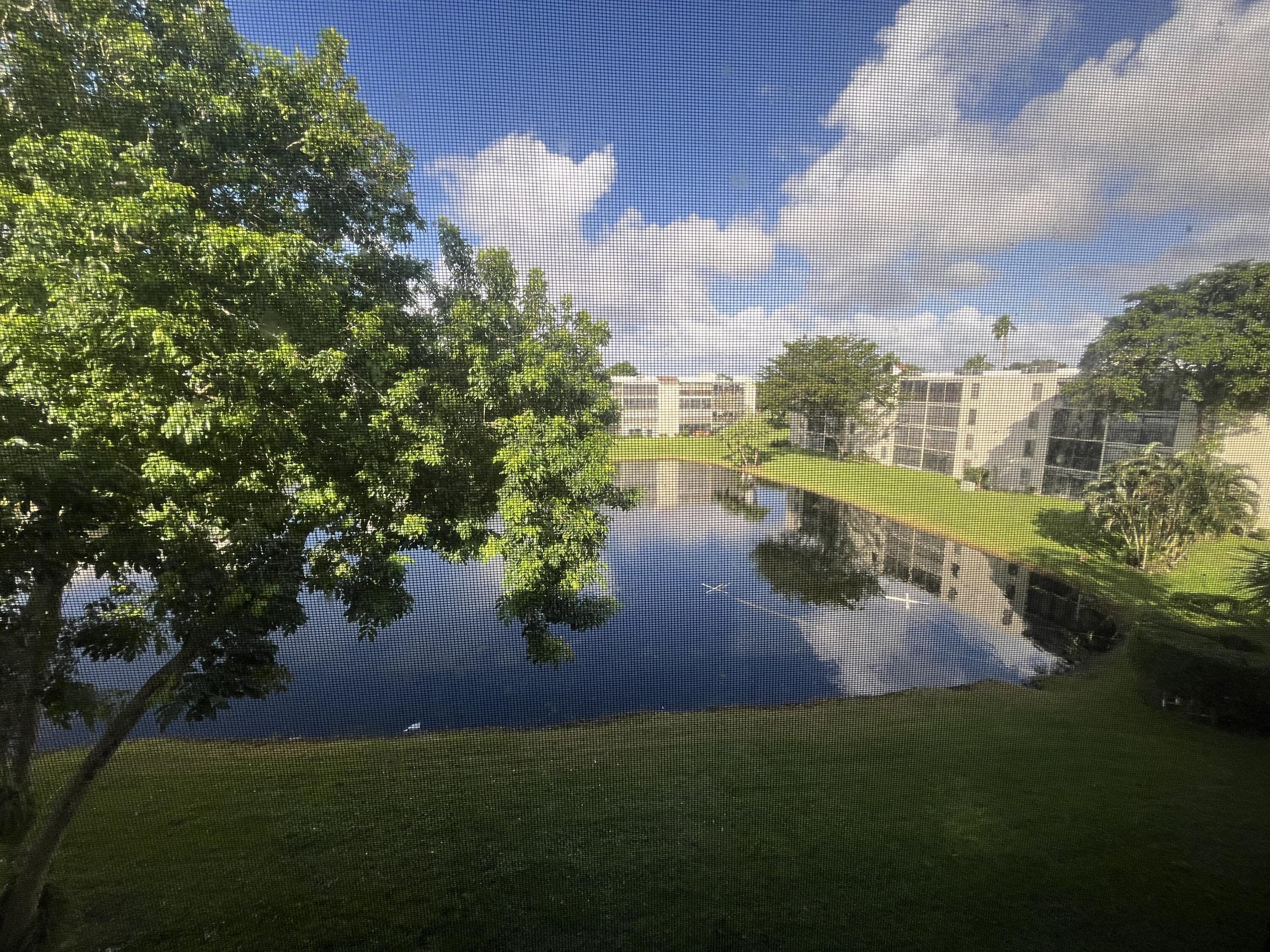 a view of a lake with a yard