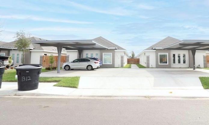 View of front of house featuring a carport