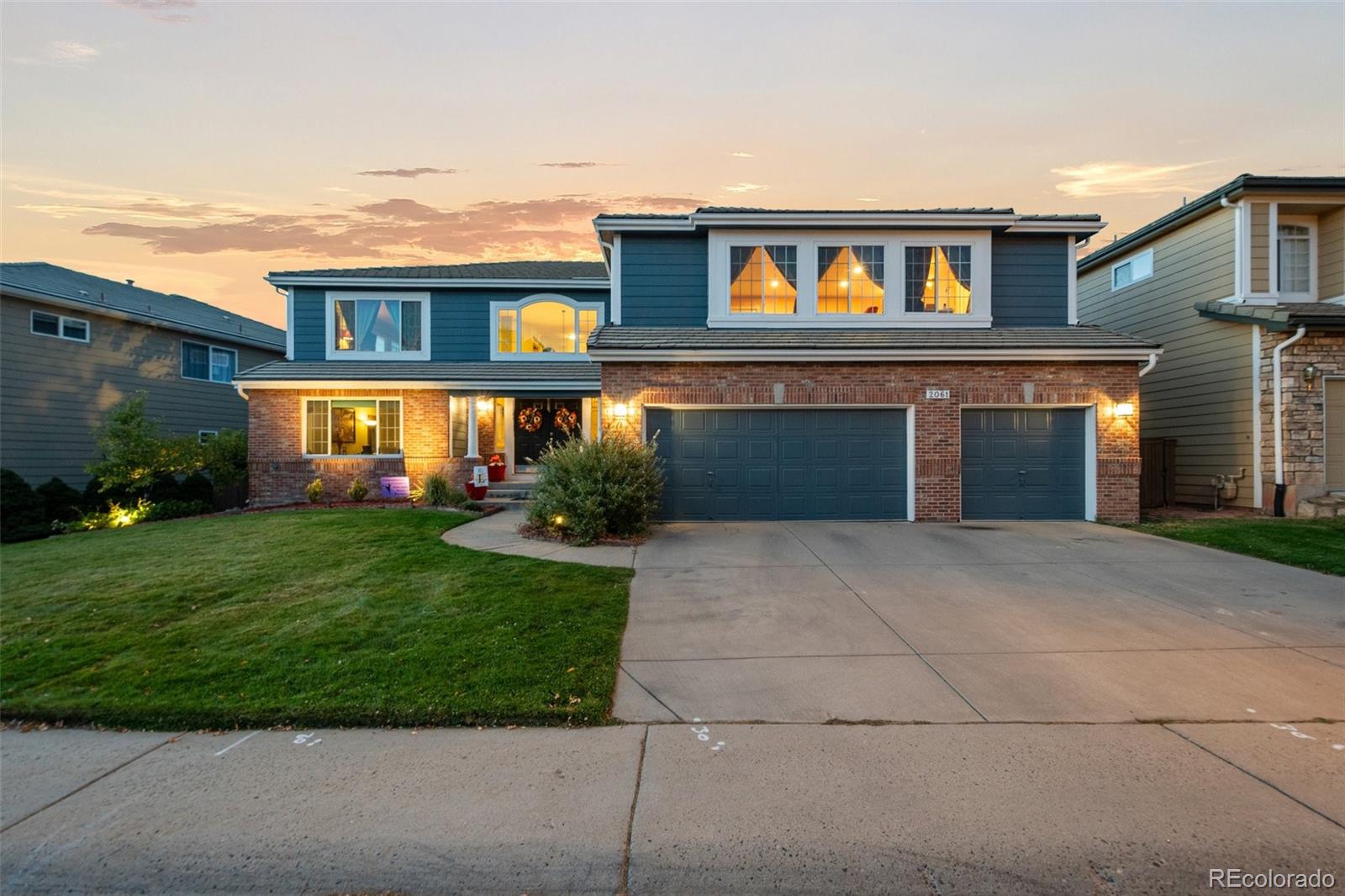 front view of a house with a yard