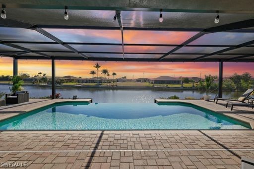 a view of a swimming pool with a outdoor seating