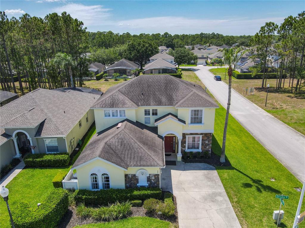 a aerial view of a house with a yard