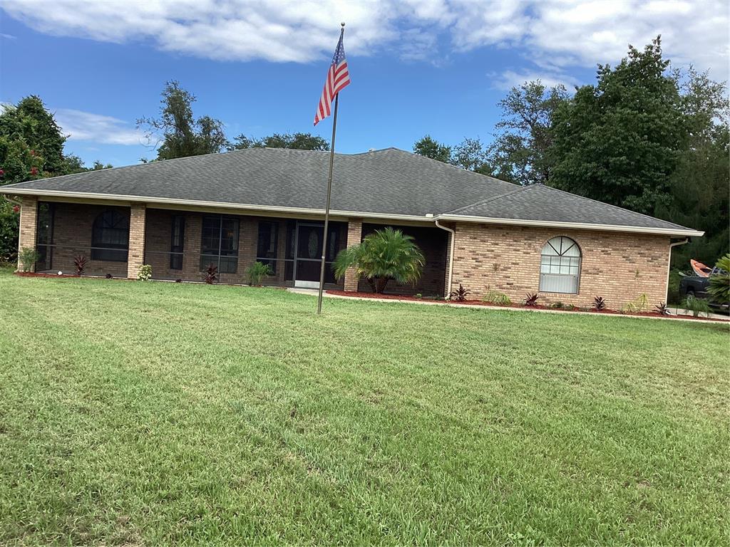 front view of a house with a yard