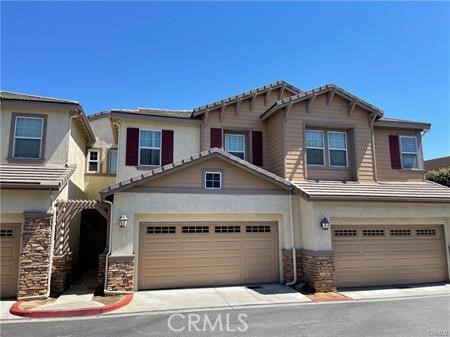 a front view of a house with a garage