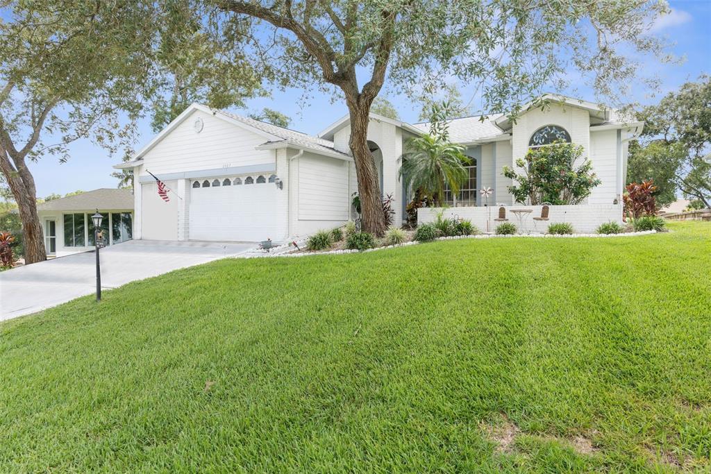 a view of a house with a yard