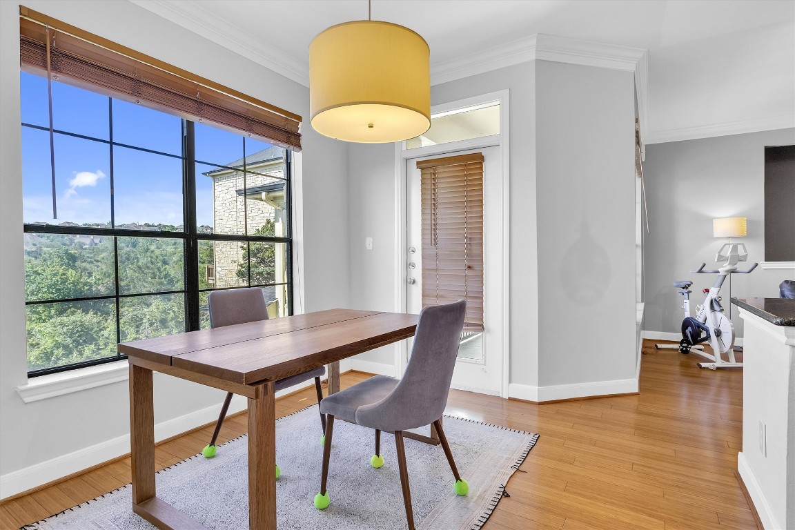 a view of a dining room with furniture window and wooden floor