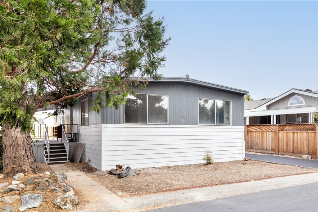 a view of a house with a tree