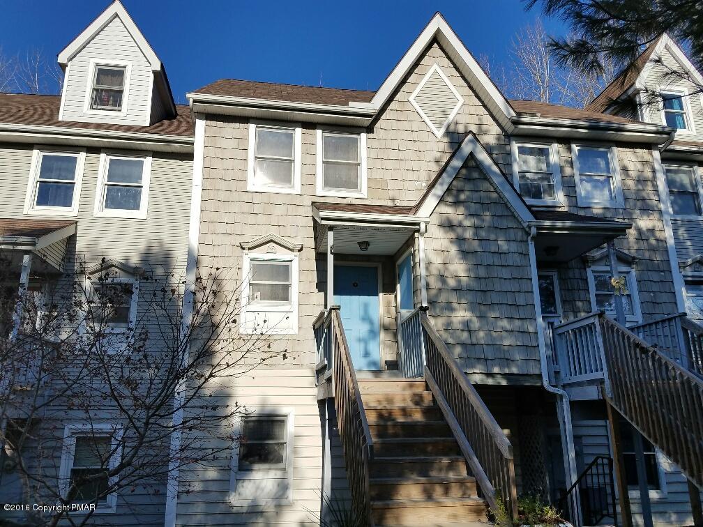 a front view of a house with many windows