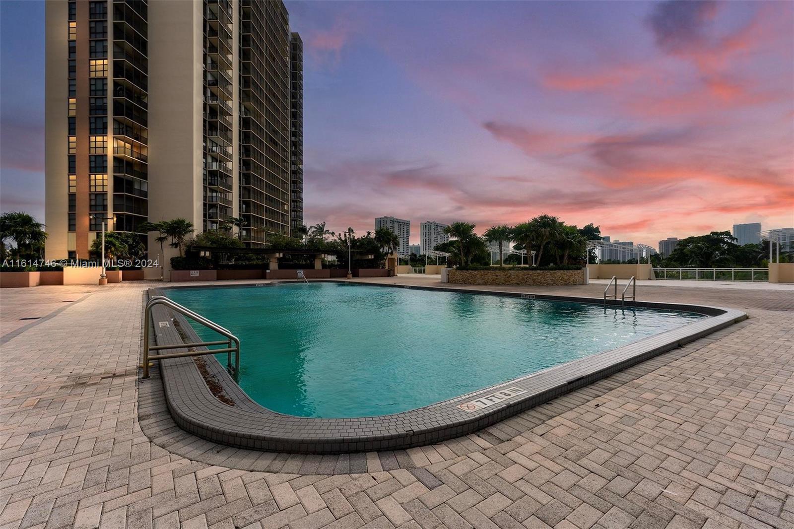 a view of a swimming pool with a yard