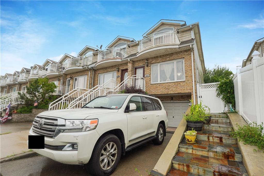 a view of a car parked in front of a house