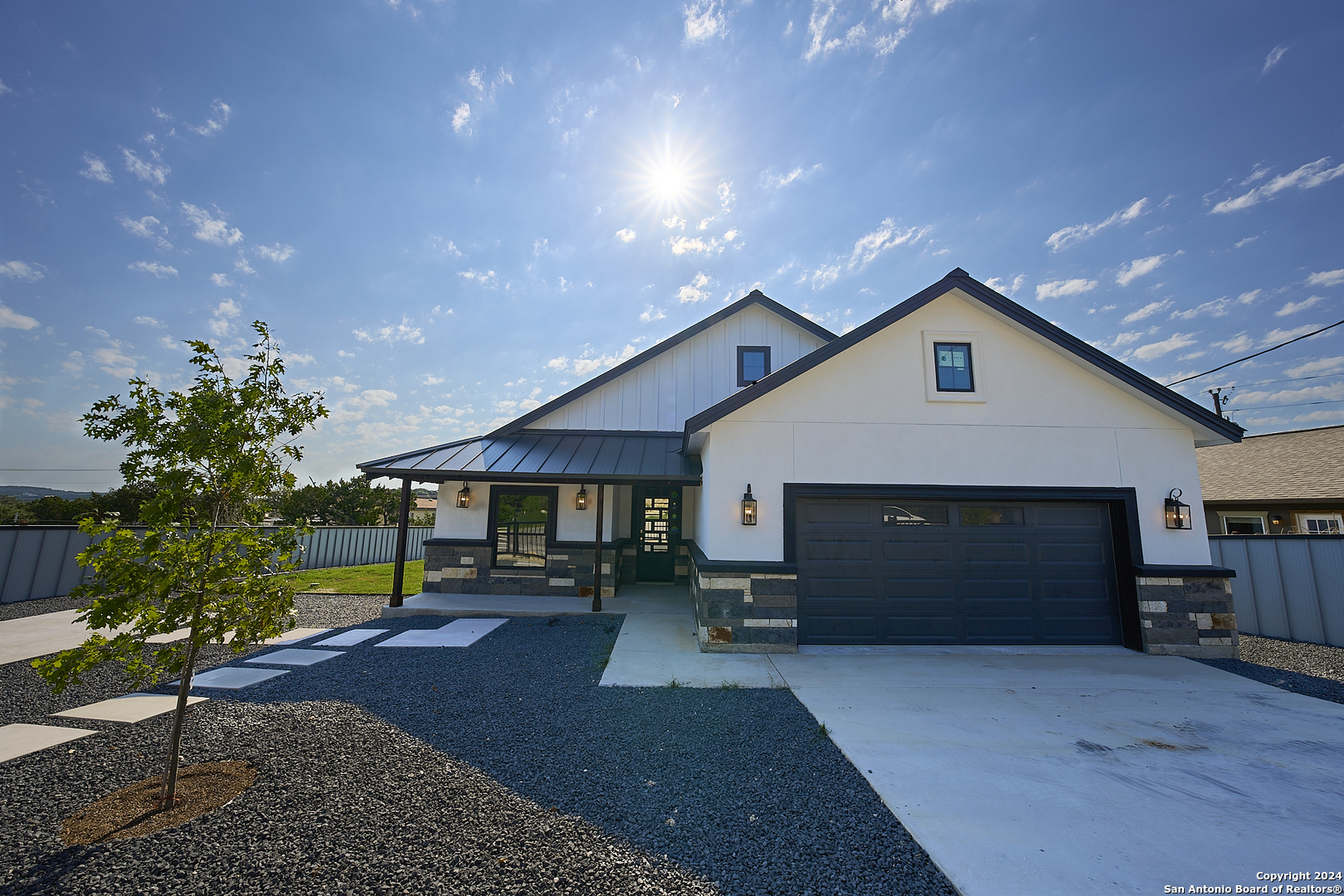 a front view of a house with garden