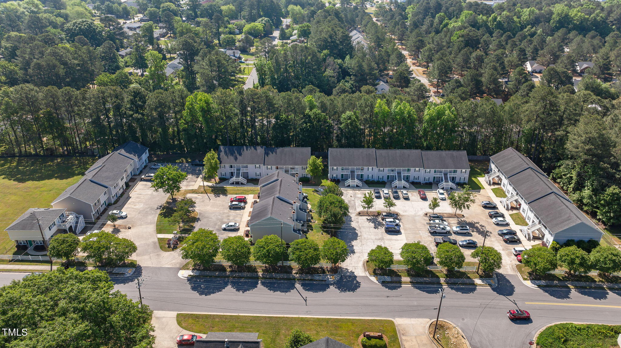 an aerial view of house with yard swimming pool and outdoor seating