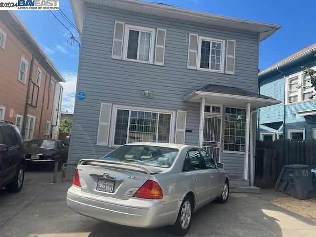 a front view of a house with parking space