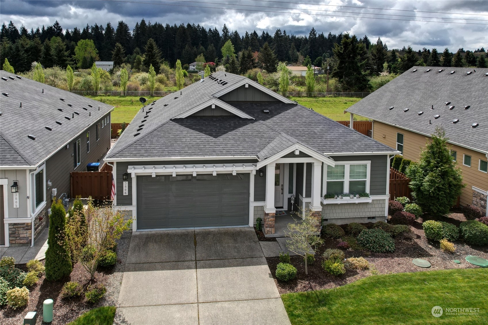 a aerial view of a house with a yard