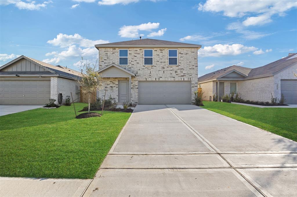 a front view of a house with yard