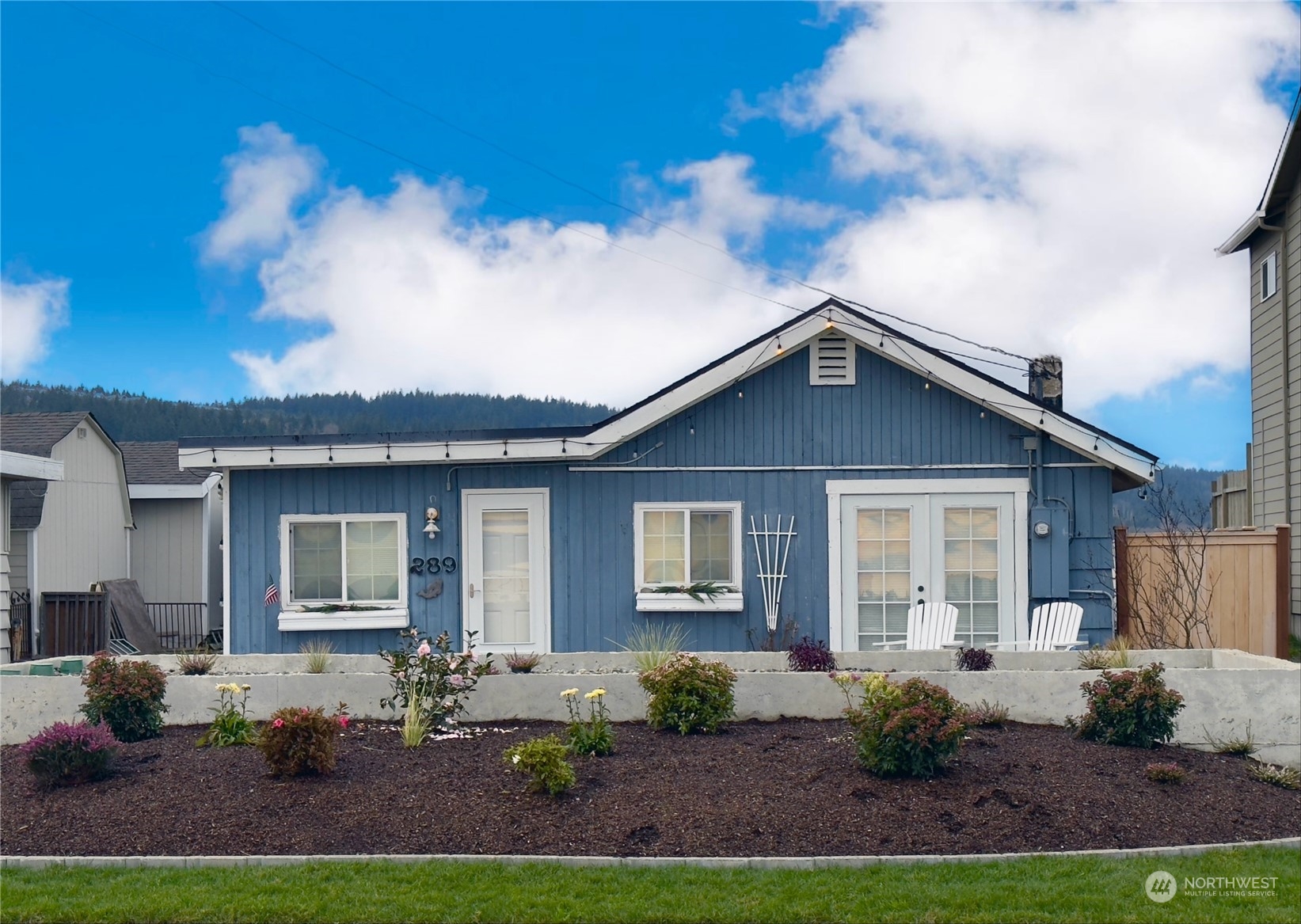 a front view of a house with a yard