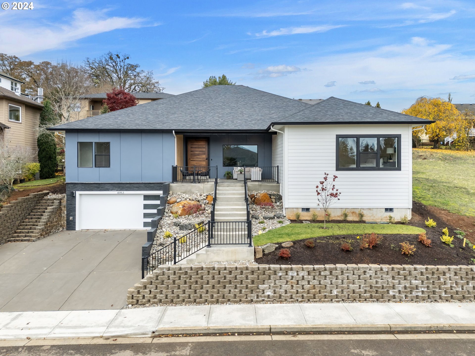 a front view of a house with garden